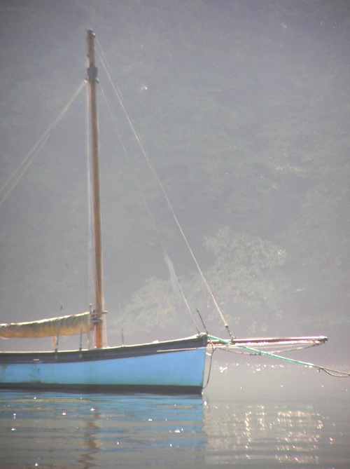 River Dart Moorings Image of a blue sailing boat moored on the River Dart in Devon
